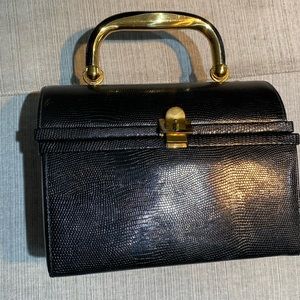 Never used. Vintage lunchbox type purse!